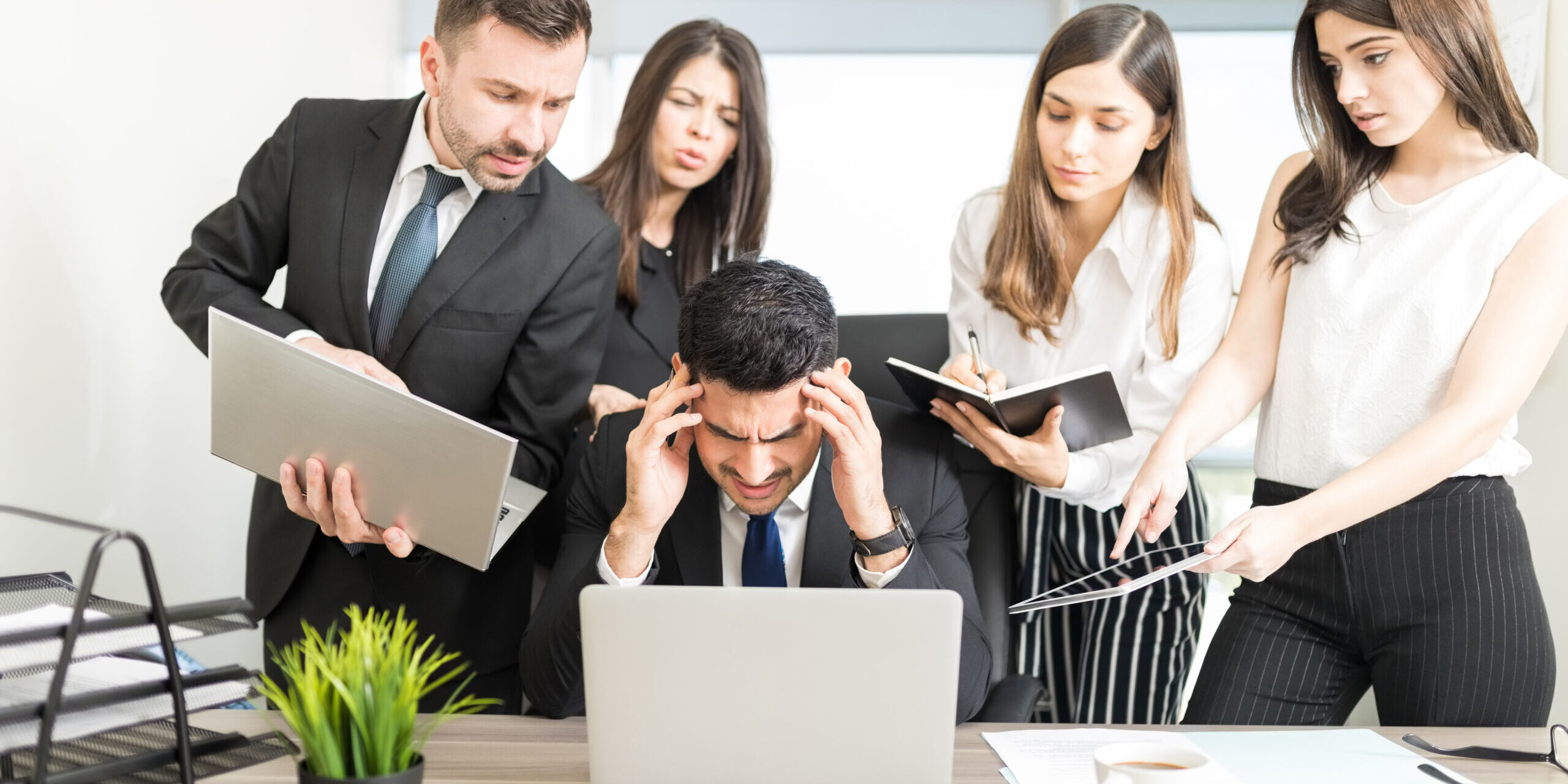 Male Business Executive Missing Deadline At Desk